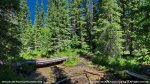Chinook Lake Provincial Recreation Area, Alberta, Canada. Wooden bridge over stream on walking trail