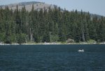 Click to enlarge Beaver Mines Lake Provincial Recreation Area, Alberta, Canada. A camper chilling in a dingy on Beaver Mines Lake.