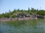 Click to enlarge Neys Provincial Park, Ontario, Canada. Canoeing in Lake Superior along the rocky shoreline.