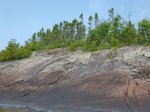 Click to enlarge Neys Provincial Park, Ontario, Canada. Canoeing in Lake Superior along the rocky shoreline.