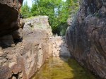 Click to enlarge Neys Provincial Park, Ontario, Canada. Canoeing in Lake Superior along the rocky shoreline.
