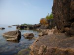 Click to enlarge Neys Provincial Park, Ontario, Canada. Canoeing in Lake Superior along the rocky shoreline.