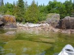 Click to enlarge Neys Provincial Park, Ontario, Canada. Canoeing in Lake Superior along the rocky shoreline.