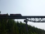 Click to enlarge Neys Provincial Park, Ontario, Canada. Canoeing on Little Pic River. Train passing overhead.