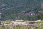 Click to enlarge Neys Provincial Park, Ontario, Canada. Sitting on beach you can see train passing in the hills in the distance