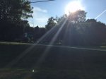 Click to enlarge Evening sun shining over main park entrance sign.