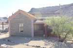 Click to enlarge Death Valley National Park, California, United States. The bottle house. This house is covered with the bottoms of glass bottles. Located in Rhyolite, a ghost town just outside the east entrance to Death Valley National park.