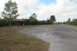 Click to enlarge E G Simmons County Park, Florida, United States. Picnic shelters along park road.