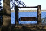 Gull Point State Park, Iowa, United States. Park bench near the Lodge overlooking the lake.