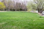 Click to enlarge Aloha State Park, Michigan, United States. Grassy picnic area on the lakeshore with grills.
