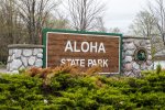 Click to enlarge Aloha State Park, Michigan, United States. State Park entrance sign