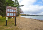Click to enlarge Burt Lake State Park, Michigan, United States. The shoreline of Burt Lake is a mixture of trees in some areas and wide sandy beaches in others. The lake itself has a sandy bottom and warms up quicker than the surrounding Great Lakes.