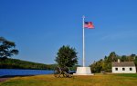 Click to enlarge Fort Wilkins Historic State Park, Michigan, United States. Shoreline of Lake Fannie Hoe with historical cannon and flag. The historical complex is adjacent to the campground.