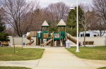 Click to enlarge East Tawas City Park, Michigan, United States. The campground is located directly beside the Tawas State Harbor. The harbor facilities are available to campers. Play structure in the state harbor.