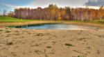 Evergreen County Park, Michigan, United States. Swimming pond located at the campground with small beach area and sandy bottom. 