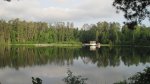 Click to enlarge Itasca State Park, Minnesota, United States. View of the fishing pier and tour boat on Lake Itasca. This was taken by the Old Timers Cabin.