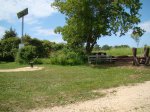 Afton State Park, Minnesota, United States. Wood pile on right, solar water pump on left. Wood is purchased in the office & then it is help yourself and sometimes cut it yourself too.