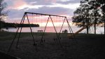 Father Hennepin State Park, Minnesota, United States. Swing set by the beach.