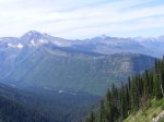 Click to enlarge Glacier National Park, Montana, United States. The mountain range is so big that its sort of surreal and hard to tell just how big and far away the mountains are.