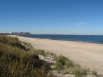 First Landing State Park, Virginia, United States. View of beach from dune crossover near campground parking lot, looking west towards Chesapeake Bay Bridge-Tunnel (which connects Virginia