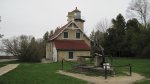 Click to enlarge Peninsula State Park, Wisconsin, United States. View of the Eagle Bluff Lighthouse and a big anchor.