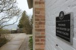 Click to enlarge Peninsula State Park, Wisconsin, United States. Historic marker on the side of the lighthouse.